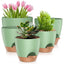 A set of 5 green self-watering plant pots in various sizes (7, 6.5, 6, 5.5, 5 inches), displayed together.