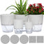 A group of five white self-watering planter pots in various sizes, suitable for indoor and outdoor plants, showcasing their modern design.